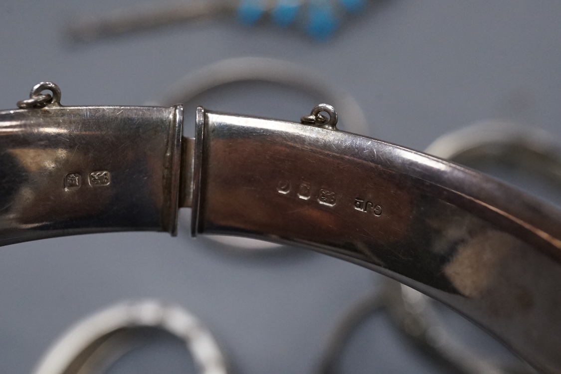A group of assorted jewellery, including silver and white metal hinged bangles, a 1960's silver mounted cigar cutter by Ramsden & Roed, 925 necklaces and bracelet, etc.